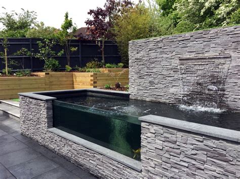 A lot of times the spawning season in our backyard koi ponds is brought to our attention because of the conditions mentioned above. Modern Sloping Garden with Feature Koi Pond | Lush Garden ...
