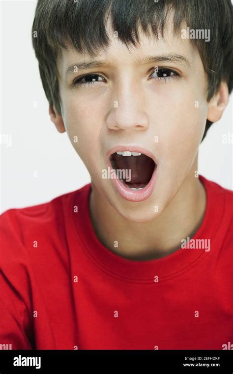 Portrait Of A Boy Yawning Stock Photo Alamy