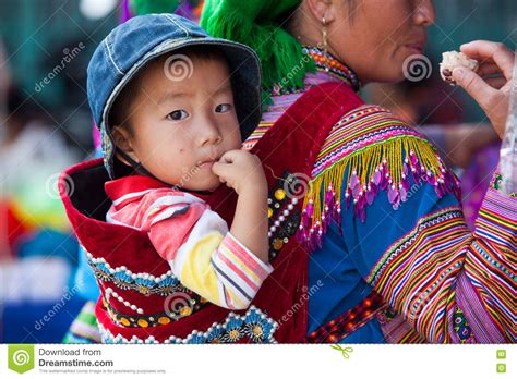 a-little-hmong-miao-child-on-his-mother-back-editorial-stock-photo