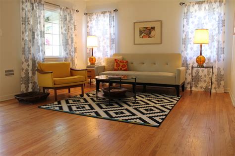 Centre modern furniture around a cubic rug. Mid Century Modern Living Room with B&W Rug - Midcentury ...