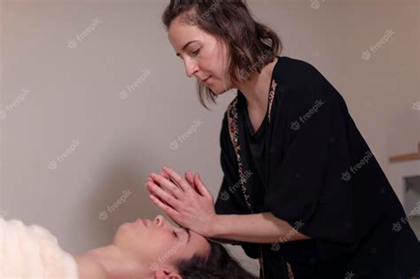 Premium Photo A Masseuse Massages The Face Of Her Patient