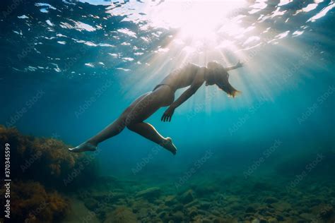Slim Woman Posing Underwater Naked Girl Glides With Sunlight In Sea