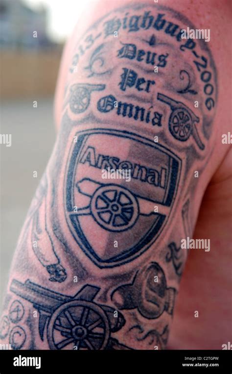 Arsenal Fc Supporter Fan With Tattoo On Arm And Back Stock Photo Alamy