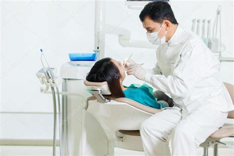 Depositphotos70660243 Stock Photo Asian Dentist Is Doing A Medical