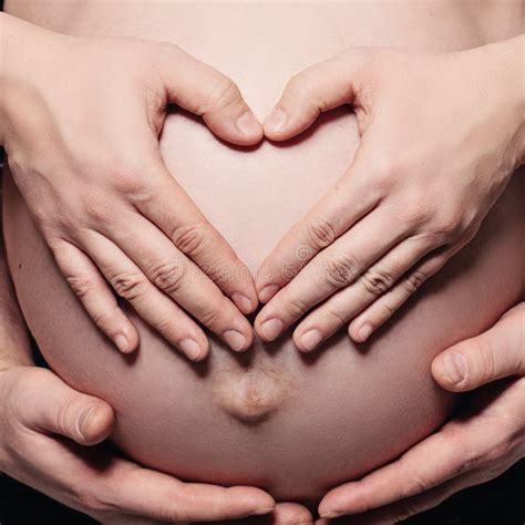 Pregnant Womans Belly With Hands Making A Heart Stock Image Image Of