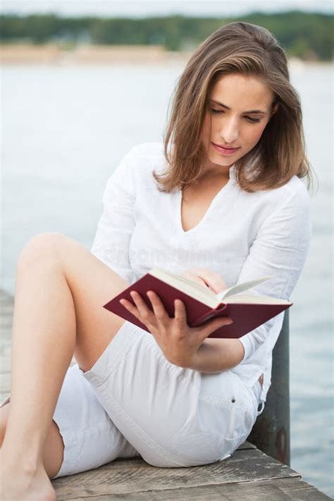 Young Woman Reading A Book Stock Photo Image Of Water 21347084