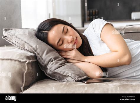 Asian Girl Sleeping On Sofa Hi Res Stock Photography And Images Alamy