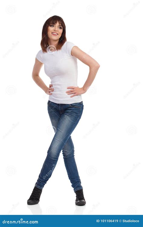 Young Woman Is Standing With Legs Crossed And Looking Away Stock Image Image Of Happy