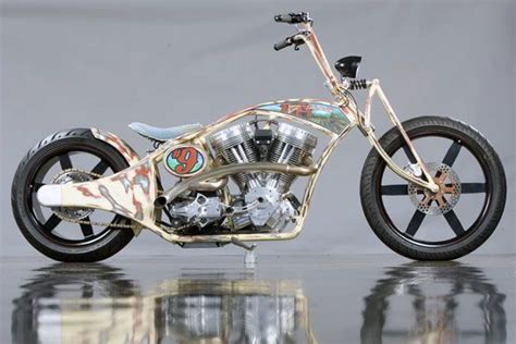 A Custom Designed Motorcycle Is Shown On A Reflective Surface