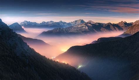 Mountains In Fog At Beautiful Night In Autumn In Dolomites Italy