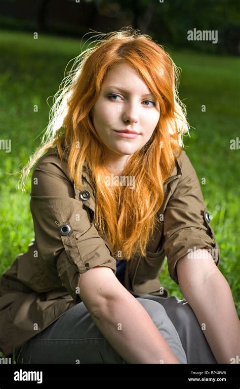 Beautiful Redhead Teen With A Serious But Cheeky Facial Expression Stock Photo Alamy