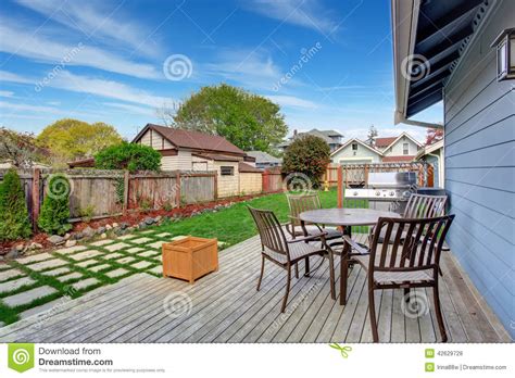 House Backyard With Patio Area On Walkout Deck Stock Photo Image Of