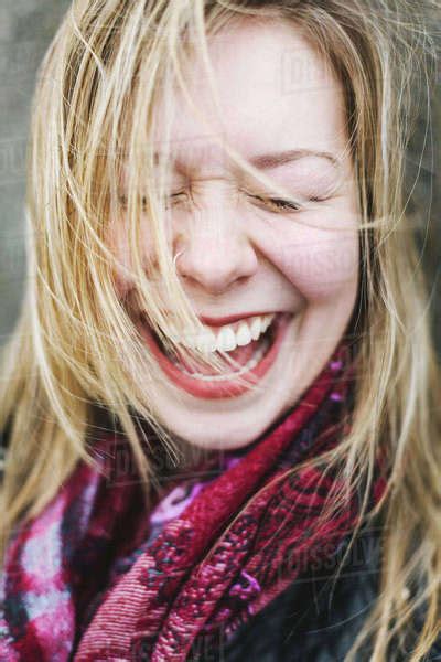 Portrait Of Woman With Eyes Closed Laughing Stock Photo Dissolve