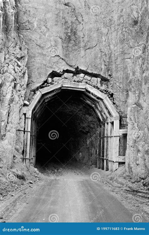 A Dilapidated Stage Coach Tunnel On An Old Mountain Dirt Road Stock