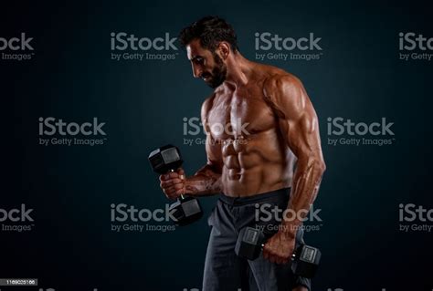 Strong Handsome Muscular Men Lifting Weights Performing Dumbbell