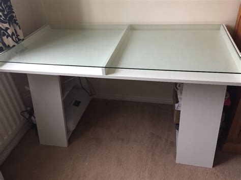 This computer table is highlighted with an attractive white metal inverted y frame design that blends beautifully with the glass top. Ikea VIKA FAGERLID white desk with glass top and storage ...