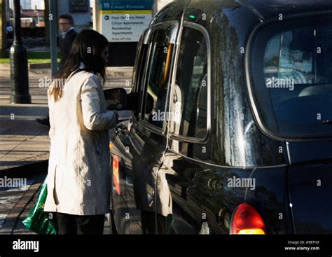 Taxi Female Passenger Pays A Cab Driver Her Fare Money Having Been Dropped Off At Canary