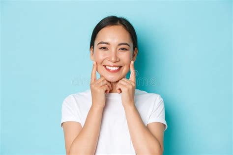 Close Up Of Beautiful Asian Girl Looking Pleased Smiling White Teeth