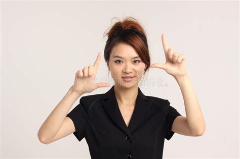 Young Chinese Lady In Formal Attire Camera Click Pose Stock Image