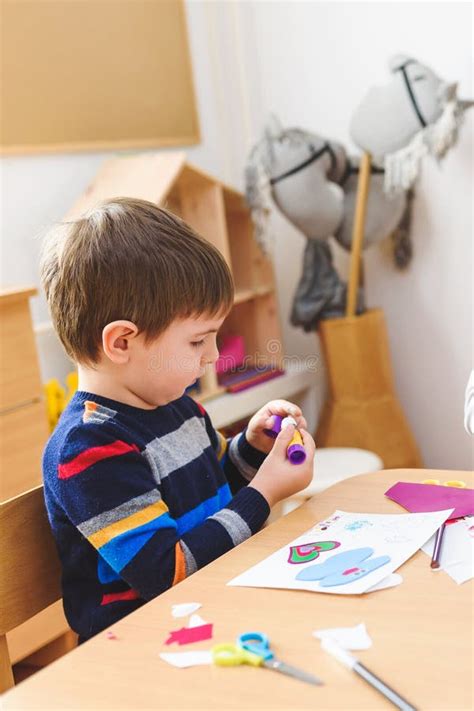 Cute Boy On Kindergarten Art Class Gluing Colorful Paper Stock Image