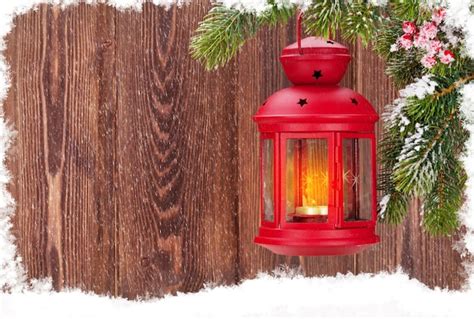 Premium Photo Christmas Candle Lantern On Fir Tree Branch In Snow
