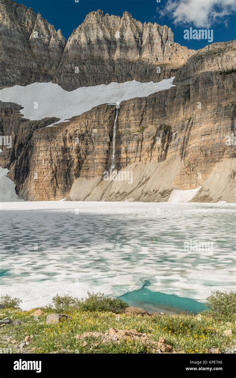Frozen Upper Grinnell Lake And The Garden Wall In Glacier National Park