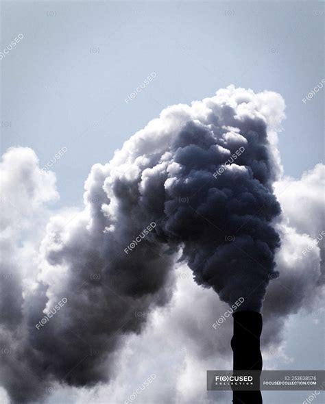 Industrial Smokestack With Clouds Of Industrial Smoke — Weathered