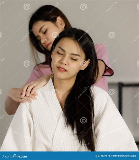 Asian Women Black Long Hair Masseuse With Pink Suite To Massage Services To Customers Woman