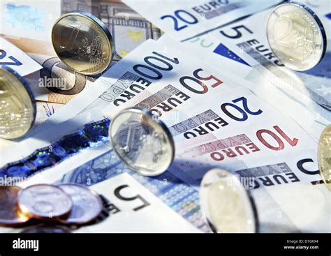 Euro Banknotes And Coins In Various Denominations Close Up Stock Photo