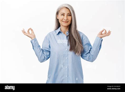 Smiling Old Asian Woman Japanese Middle Aged Woman With Grey Hair Showing Zen Peace