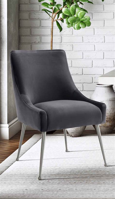 Maybe you would like to learn more about one of these? BEATRIX GREY VELVET CHAIR WITH SILVER LEGS - Michele Pelafas