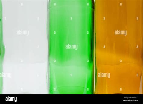 Empty Glass Bottles Of Mixed Colors Including White Green And Amber