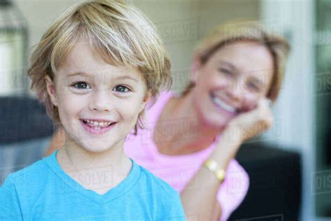 Caucasian Boy Smiling With Mother Stock Photo Dissolve