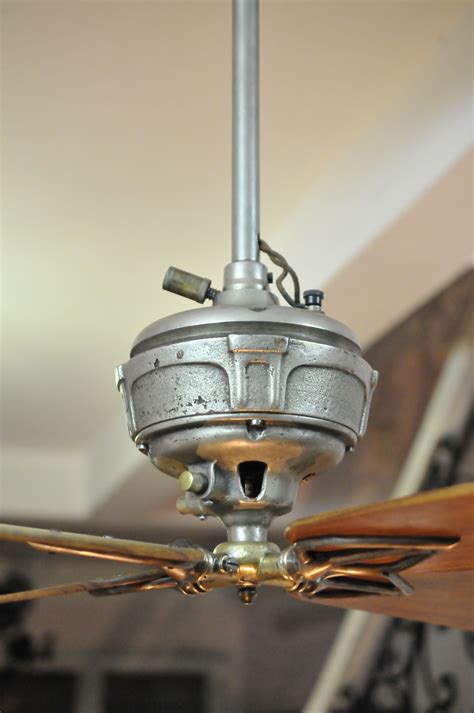 An old ceiling fan which a very loose light fixture. Antique ceiling fan