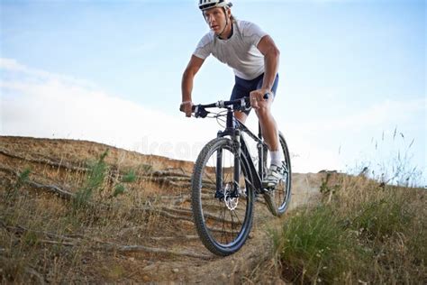 Nothing Beats An Extreme Bike Ride Fit Cyclist Riding Across Rough Terrain While Out In Nature