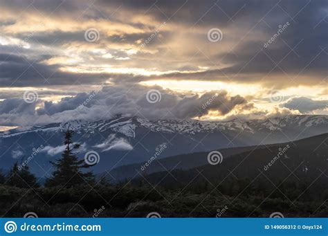 Mountain Peak In The Clouds And Fog At Sunset Stock Photo Image Of