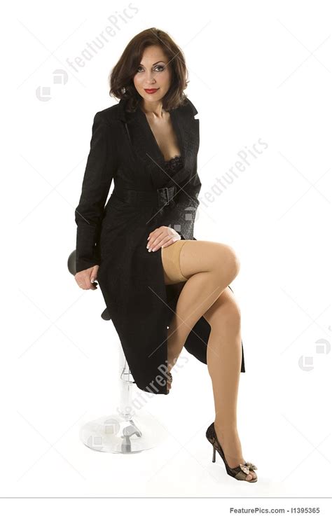 Image Of Fashion Model In A Black Coat Poses In Studio
