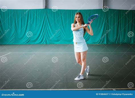 Portrait Of Young Girl Tennis Player In A Tennis Court Indoor Stock