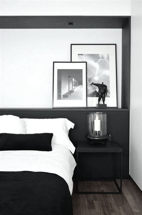 Black walls contrast starkly with a crisp white ceiling and white bedding. Black and white bedroom . Home Decor . Interior Design ...
