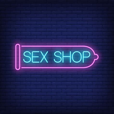 Sex Shop Letrero De Neón Condón Rosado En La Pared De Ladrillo Free Nude Porn Photos