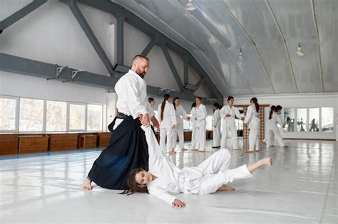 Premium Photo Aikido Sensei And Teenage Female Student Training