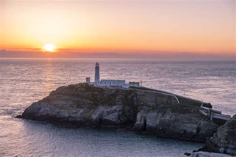 Sunset At South Stack Lighthouse On Anglesey In Wales Stock Photo