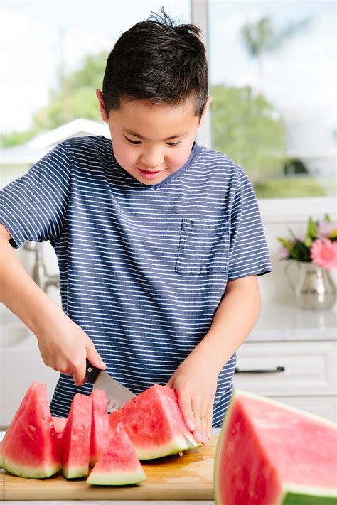 Boy Preparing Snack In Kitchen By Stocksy Contributor Curtis Kim
