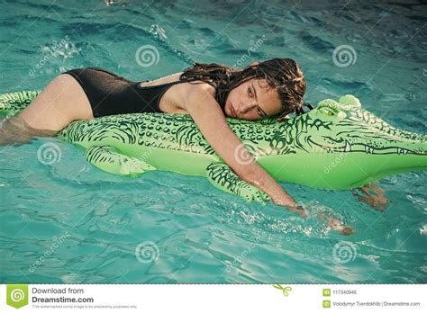 Adventures Of Girl On Crocodile Woman On Sea With Inflatable Mattress