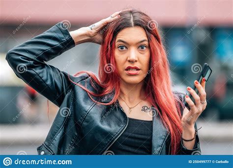 girl with mobile phone with expression of surprise or astonishment stock image image of phone
