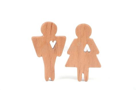 Silhouettes Of Man Woman And Heart Cut Out Inside The Shapes On A