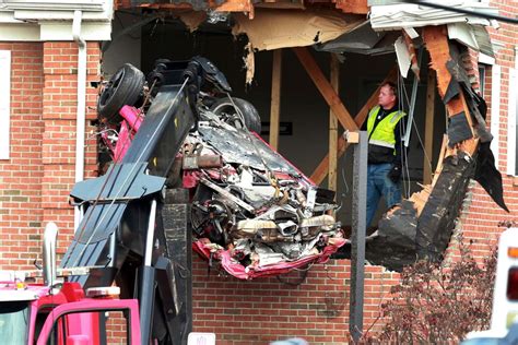 Two Killed After Speeding Porsche Crashes Into Second Floor Of Building