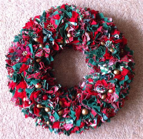 Christmas Wreath Made From Folded 2 Squares Of Fabric Pushed Into A