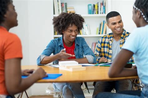 Group Of African And South American Students In Discussion Stock Photo