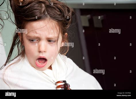 Five Year Old Girl Having Hair Cut Protests As Tangled Hair Gets Pulled